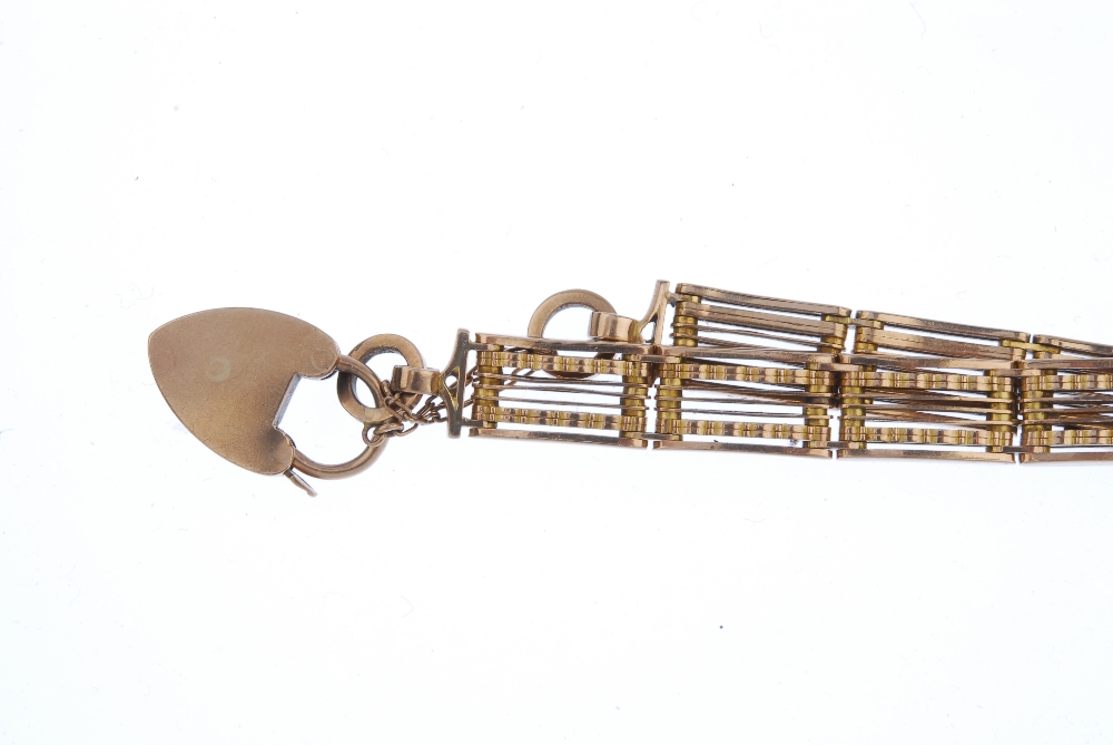 An early 20th century 9ct gold gate bracelet. Designed as a series of gate-links, with textured - Image 2 of 2