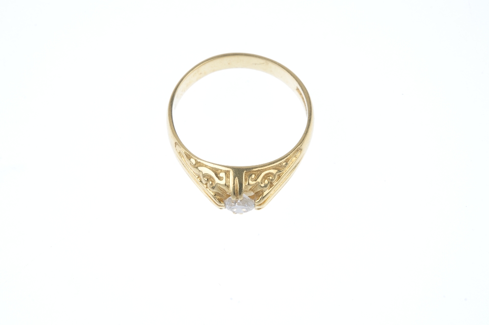 An 18ct gold diamond single-stone ring. The brilliant-cut diamond, to the scrolling sides and - Image 2 of 4