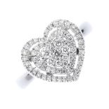 A diamond cluster ring. The pave-set diamond heart-shape cluster, within a brilliant-cut diamond