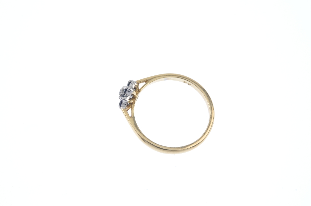 A diamond and sapphire cluster ring. The brilliant-cut diamond, within an circular-shape sapphire - Image 3 of 4