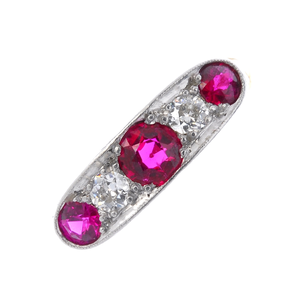 A mid 20th century 18ct gold synthetic ruby and diamond five-stone ring. The circular-shape