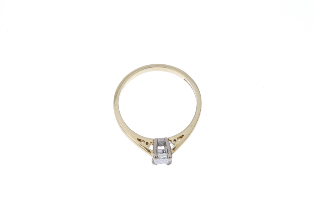 An 18ct gold diamond single-stone ring. The square-shape diamond, to the tapered shoulders and plain - Image 2 of 4