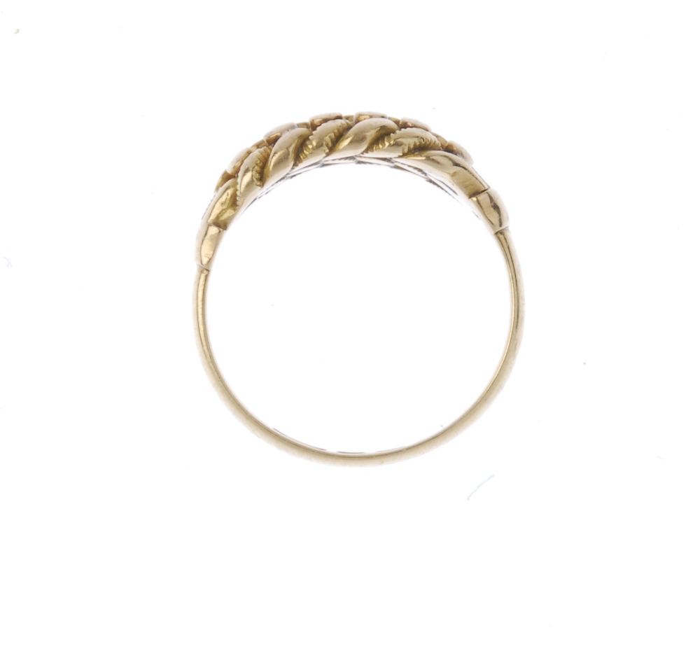 An Edwardian 18ct gold keeper ring. Of interwoven design, with bead accents, to the plain band. - Image 2 of 3