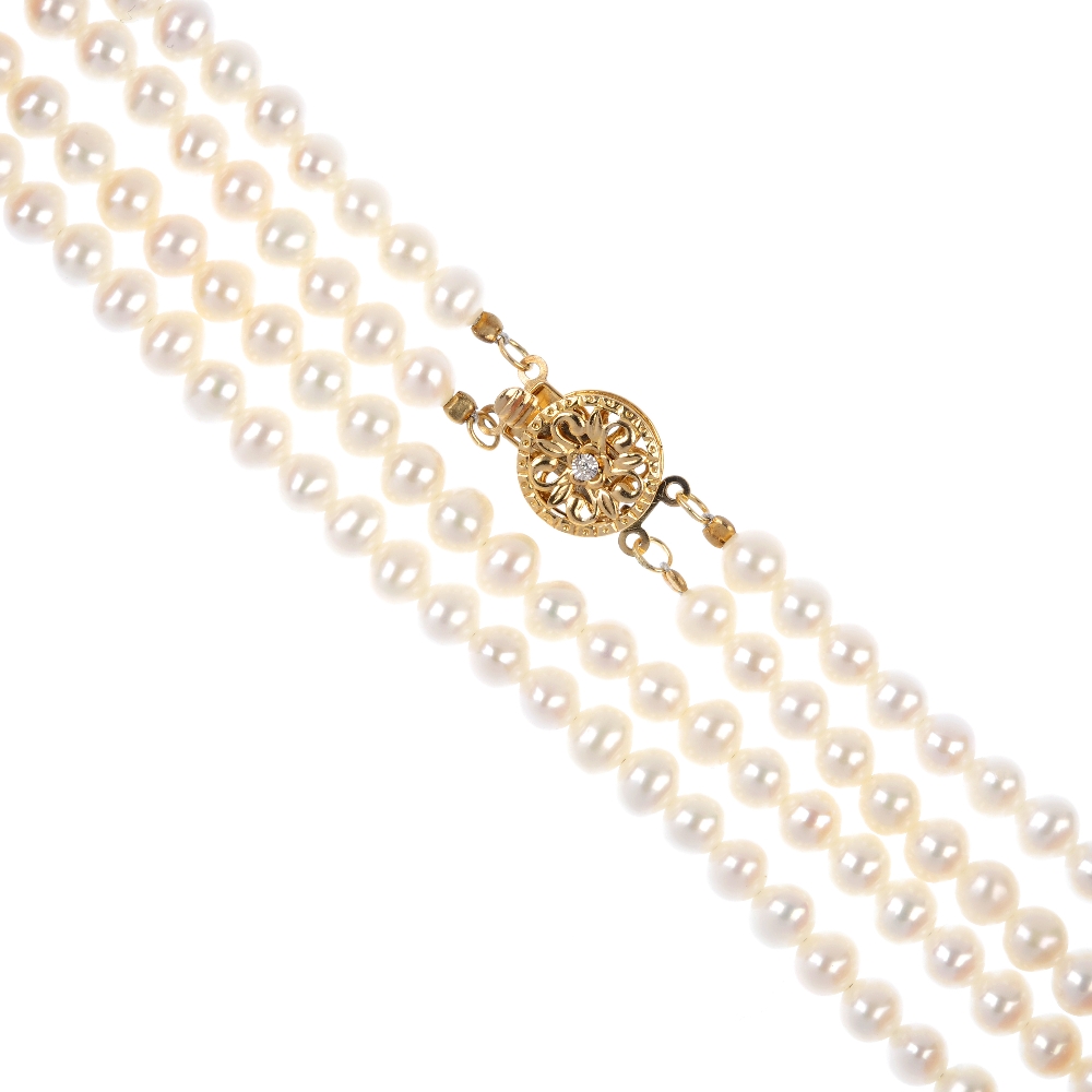 A freshwater cultured pearl two-row necklace. Each row comprising a series of uniform freshwater