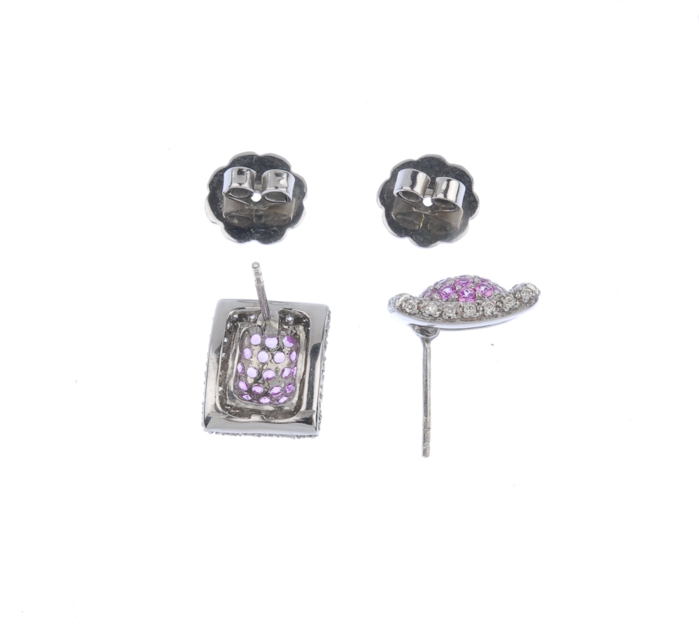 (117589) A pair of diamond and sapphire ear studs. Of curved rectangular form, the pave-set pink - Image 2 of 3