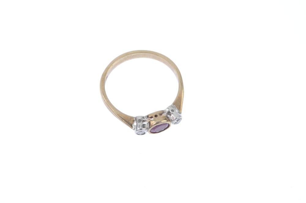 A 9ct gold ruby and diamond ring. The oval-shape ruby, with brilliant-cut diamond sides, to the - Image 2 of 4