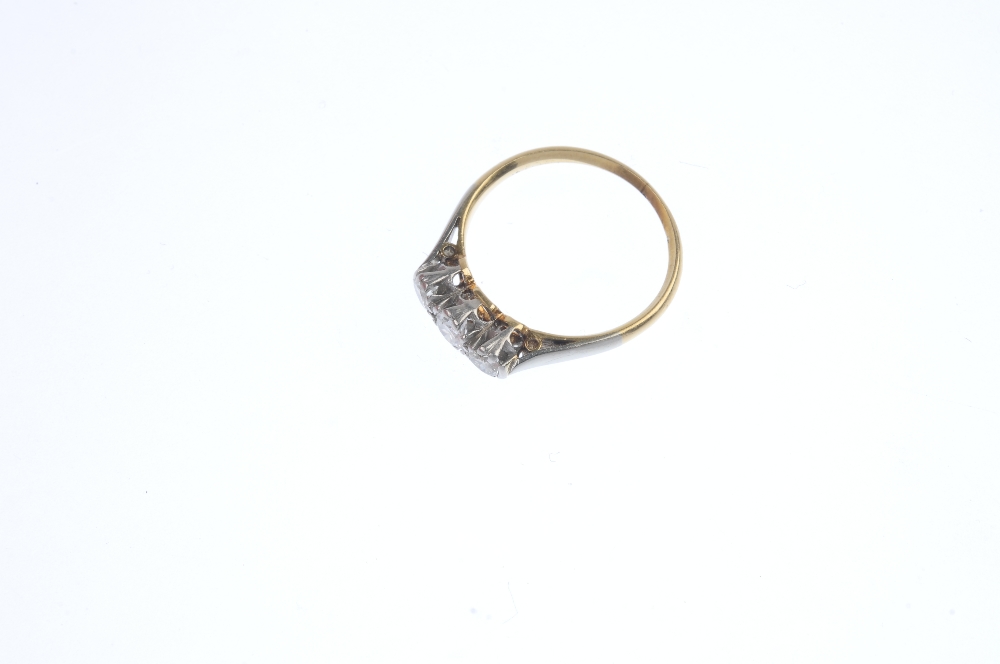 A mid 20th century gold and platinum diamond three-stone ring. The brilliant-cut diamonds, to the - Image 2 of 4