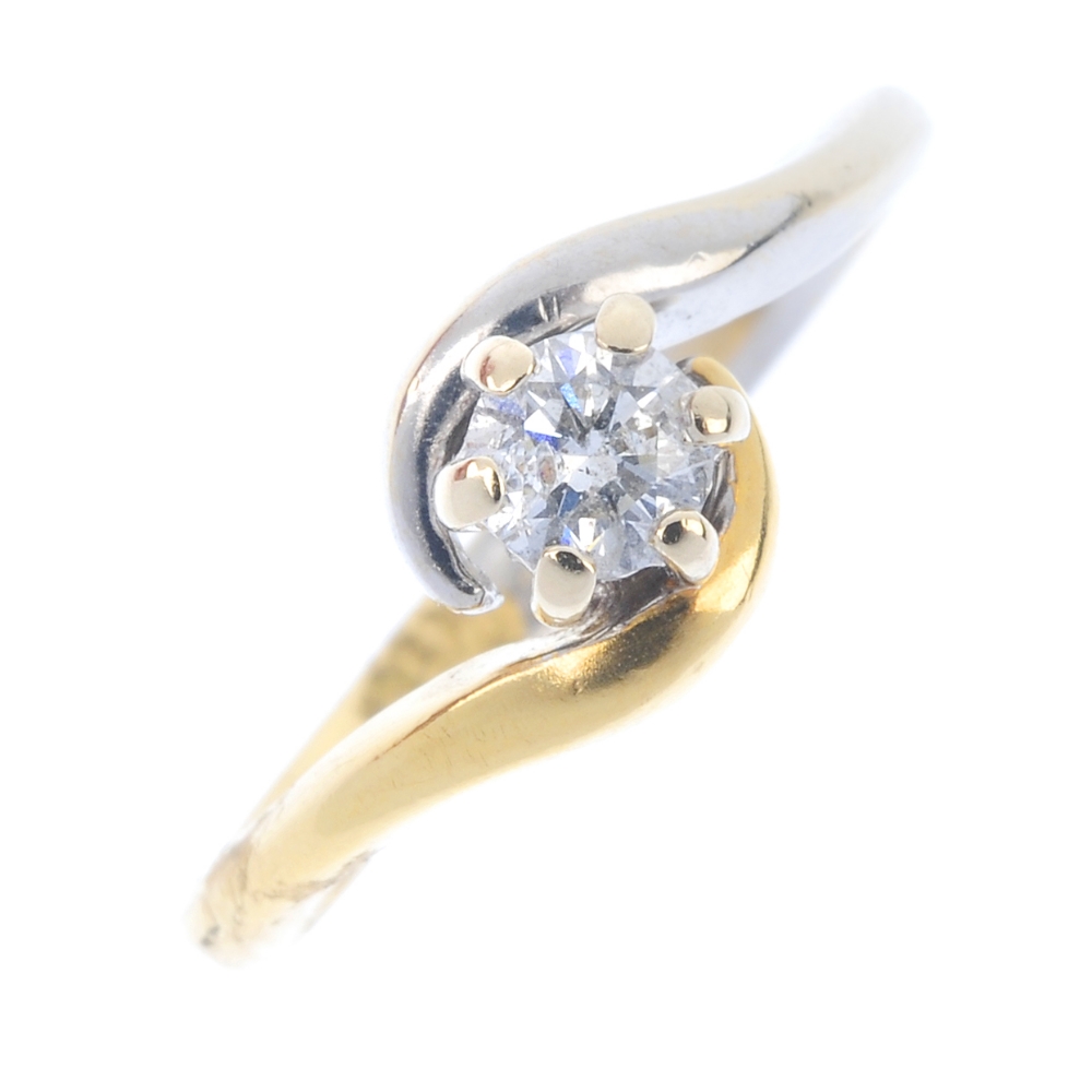 An 18ct gold diamond crossover ring. Of bi-colour design, the brilliant-cut diamond, to the