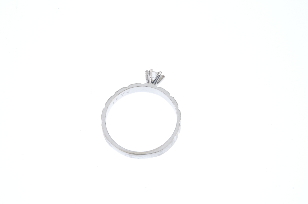 A diamond single-stone ring. The brilliant-cut diamond, to the textured sides and plain band. - Image 4 of 4