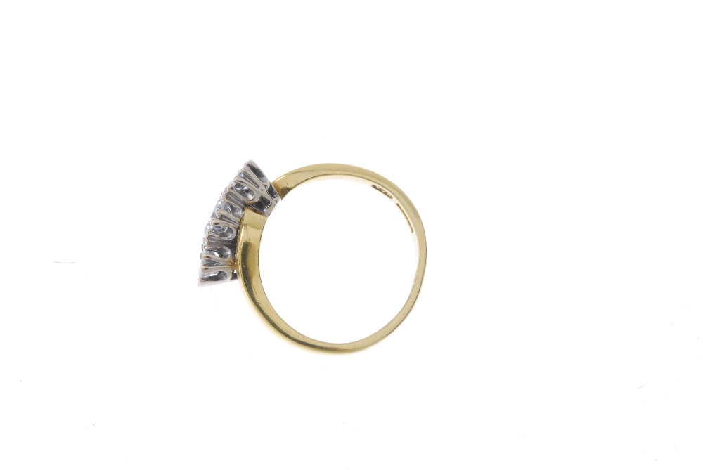 An 18ct gold diamond three-stone ring. The slightly graduated brilliant-cut diamond diagonal line, - Image 3 of 4