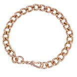 A 9ct gold curb-link bracelet. Hallmarks for London. Length 22.8cms. Weight 44.7gms.  Overall