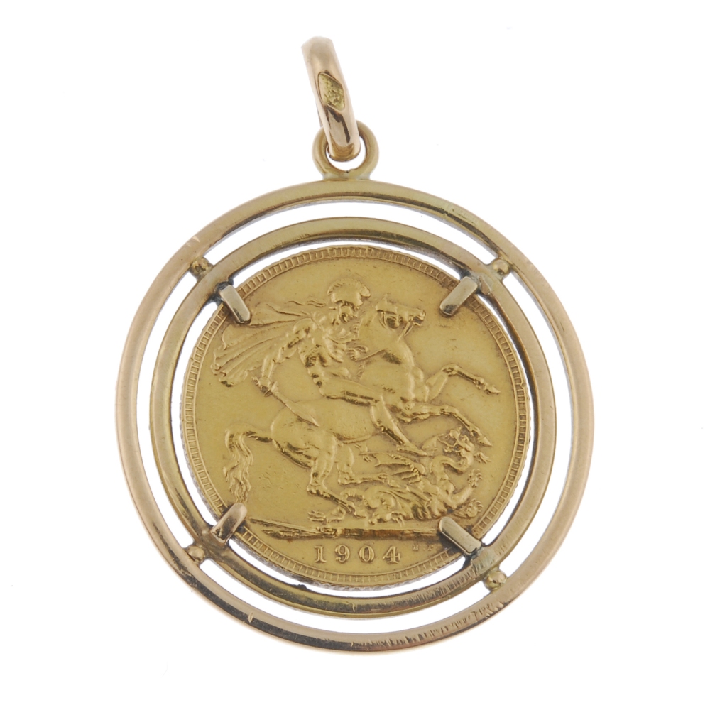 A mounted sovereign pendant. The Edward VII sovereign, dated 1904, within a later double halo, - Image 2 of 2