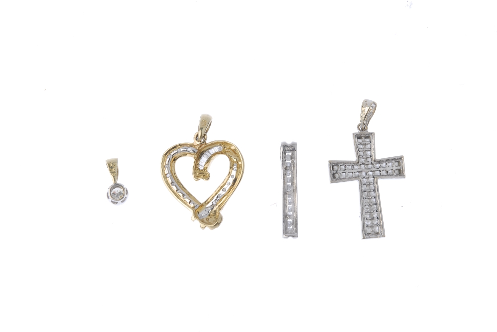 A selection of four diamond pendants. To include an 18ct gold diamond cross pendant, a 9ct gold - Image 2 of 2