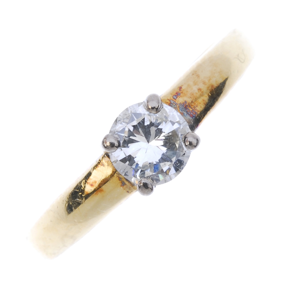 An 18ct gold diamond single-stone ring. The brilliant-cut diamond, to the plain band. Estimated