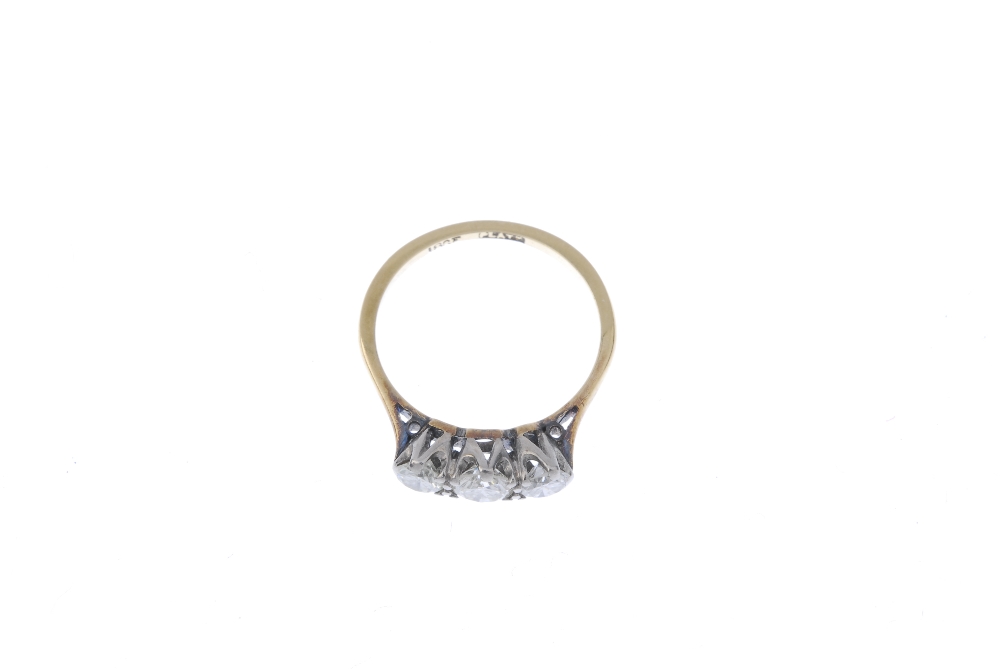 A mid 20th century 18ct gold and platinum diamond three-stone ring. The graduated circular-cut - Image 2 of 4