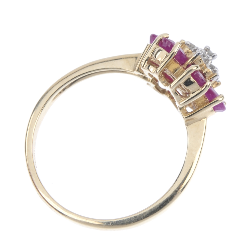 A 9ct gold diamond and ruby floral cluster ring. The single-cut diamond stepped cluster, within an - Image 4 of 4