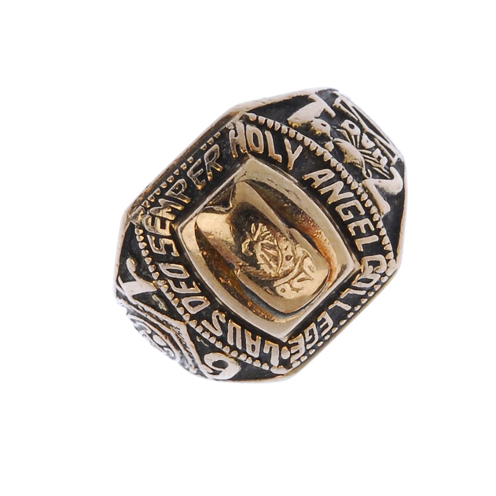 (539760-1-A) A college ring. With script, date 1971 and various insignia. Personal inscription.