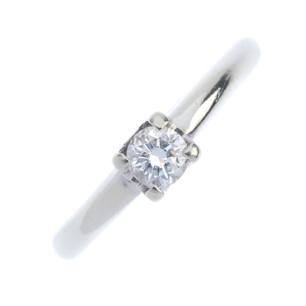 An 18ct gold diamond single-stone ring. The brilliant-cut diamond, to the tapered band. Estimated