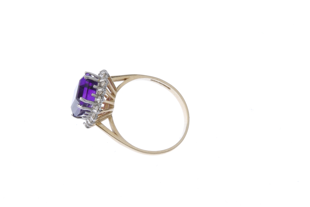 A 9ct gold amethyst and diamond cluster ring. The square-shape amethyst within a brilliant-cut - Image 3 of 4