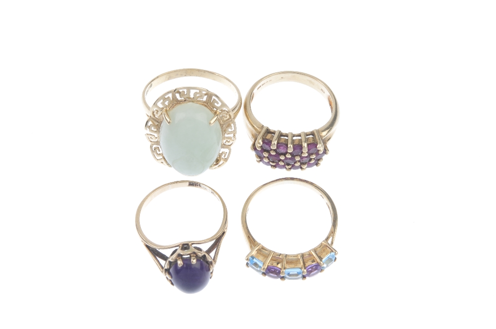 A selection of four gem-set dress rings. To include an amethyst and blue topaz five-stone ring, a - Image 2 of 3