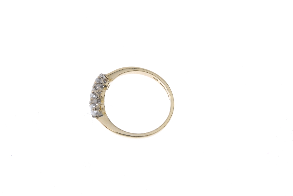 An 18ct gold diamond three-stone ring. The slightly graduated brilliant-cut diamond line, to the - Image 3 of 4