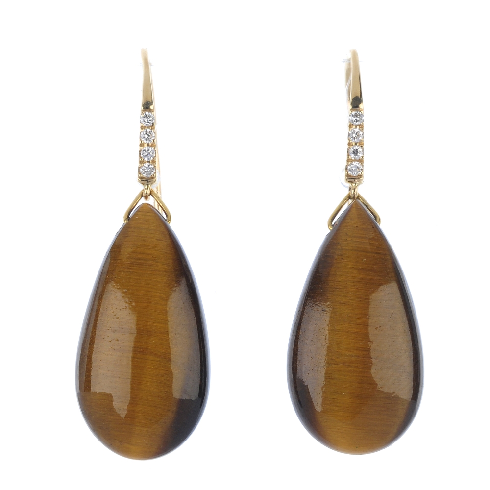 A tigers eye jewellery set. To include a pair of ear pendants, each designed as a tigers-eye drop,