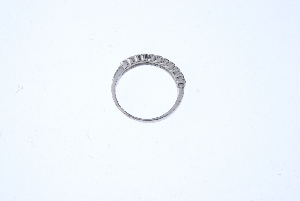 An 18ct gold sapphire and diamond half-circle eternity ring. The alternating circular-shape sapphire - Image 4 of 4