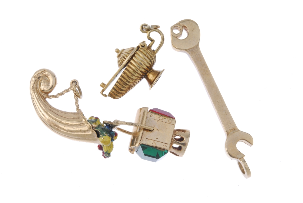 A selection of four 9ct gold charms. To include a spanner charm, a paste lantern charm, together - Image 2 of 2