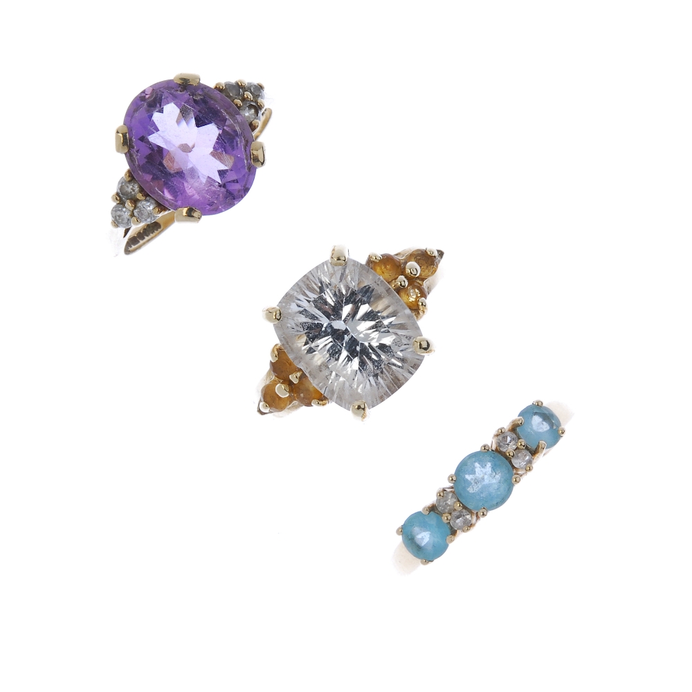 A selection of three 9ct gold gem-set dress rings. To include an amethyst ring with cubic zirconia