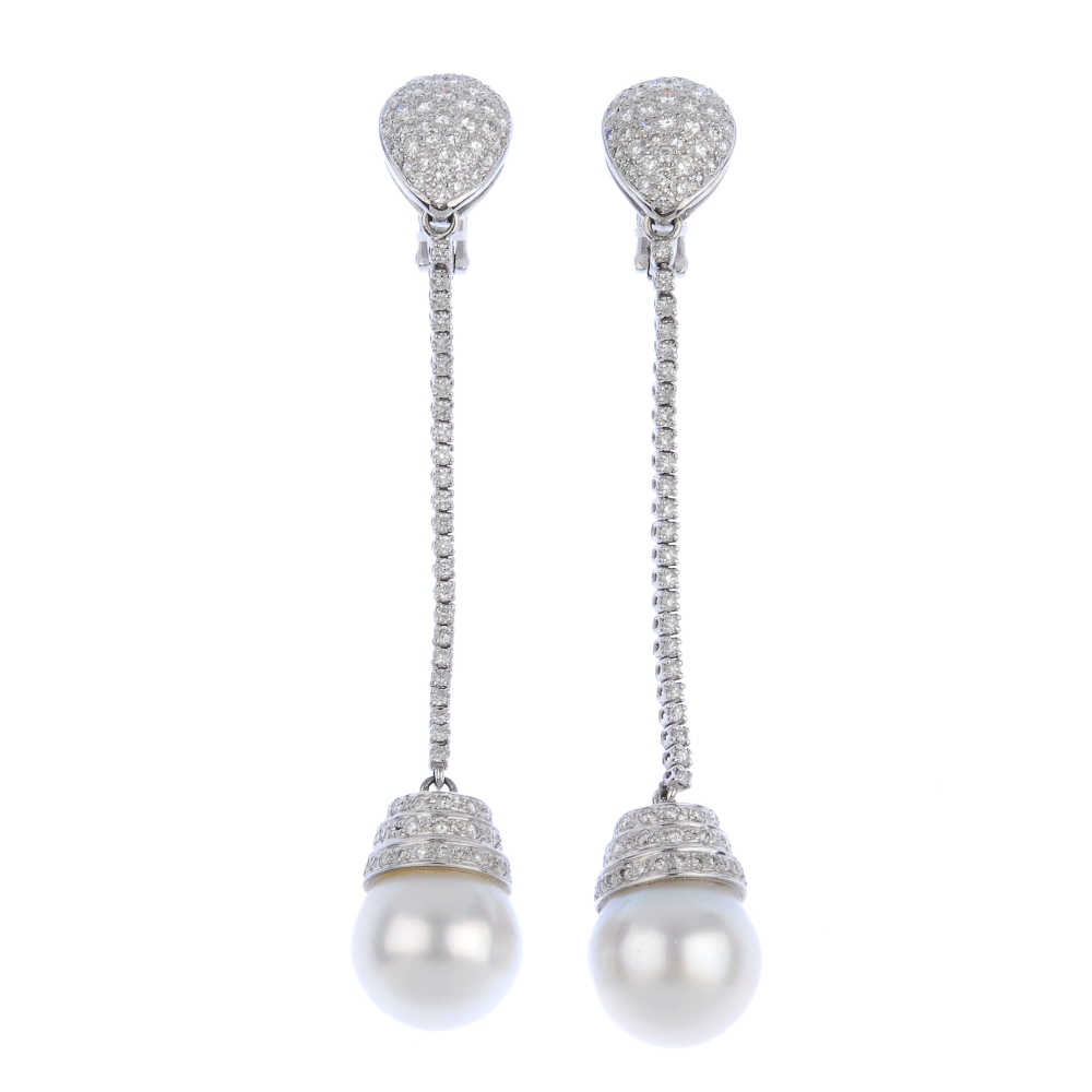 (539860-3-A) A pair of cultured pearl and diamond ear pendants. Each designed as a cultured pearl,