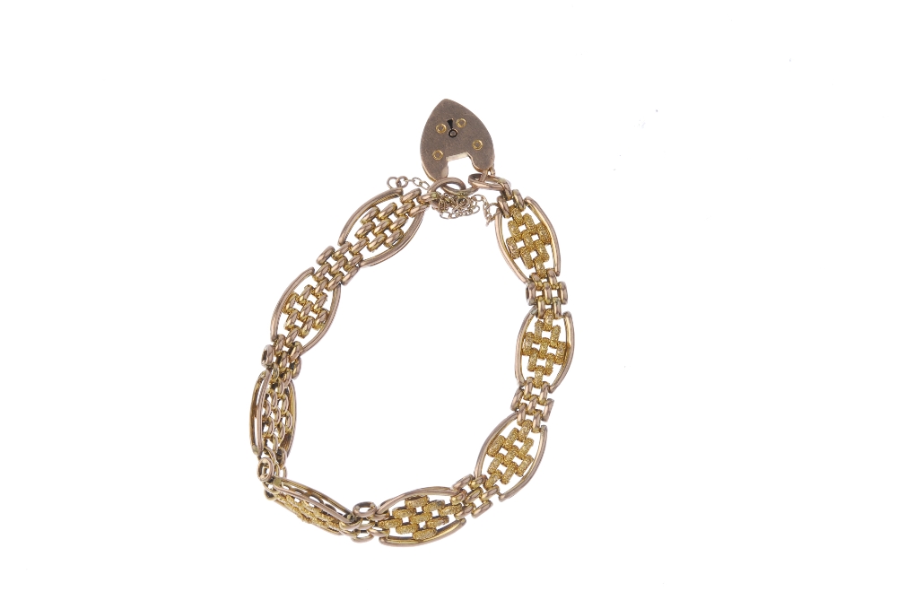 An early 20th century 9ct gold bracelet. Designed as a series of textured brick-link panels, with - Image 2 of 2