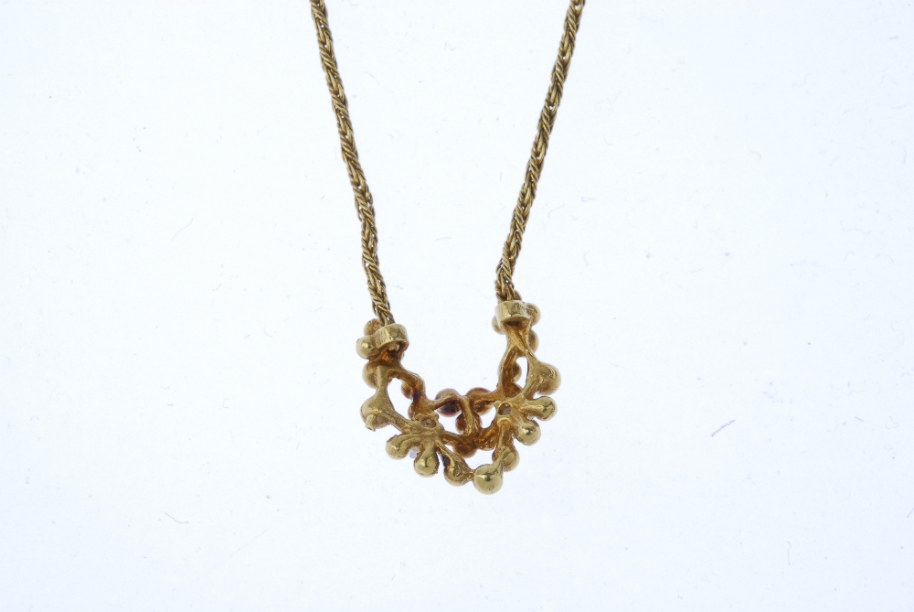 An 18ct gold diamond pendant. Of openwork design, the bead panel, with brilliant-cut diamond - Image 2 of 3