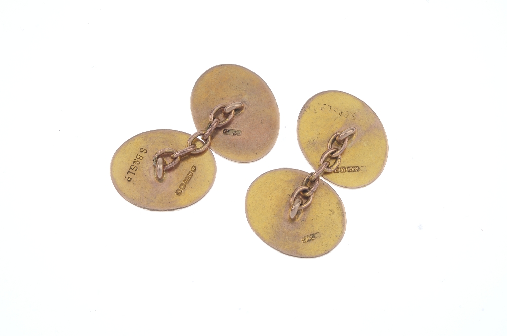 A pair of early 20th century 9ct gold cufflinks. Each designed as two oval-shape engine turned - Image 2 of 2