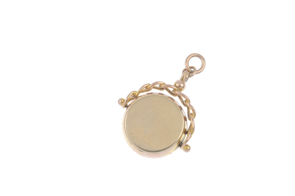 An early 20th century 9ct gold swivel fob. The scrolling foliate engraved front and plain reverse, - Image 2 of 2
