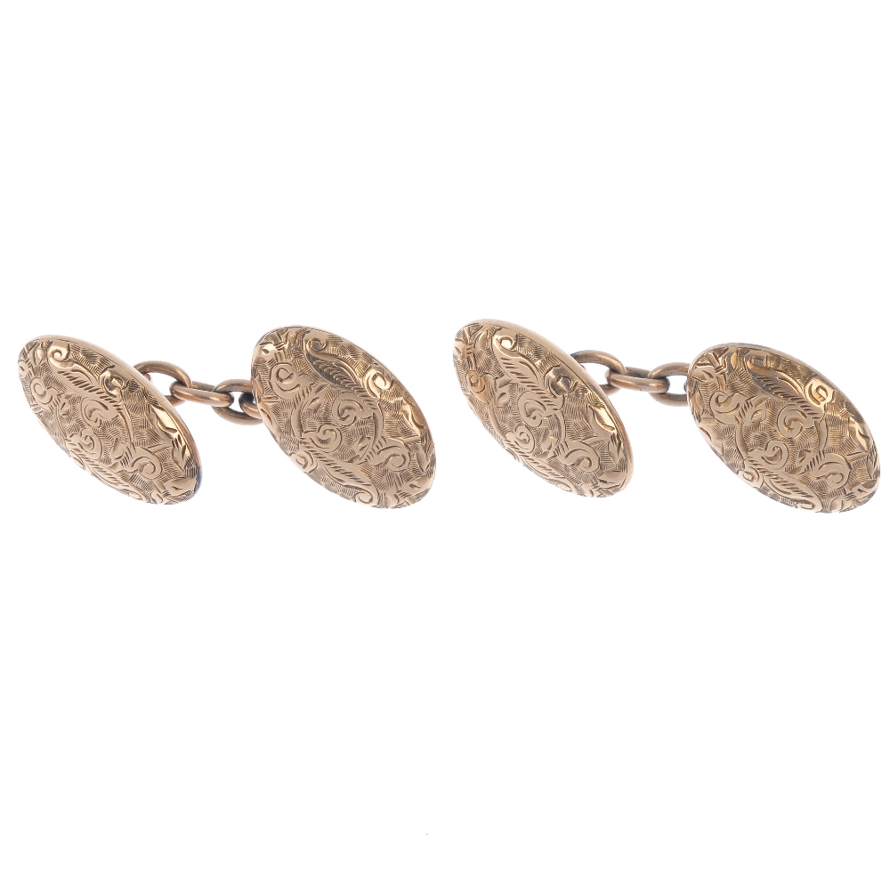 Two pairs of early 20th century 9ct gold cufflinks. Each pair designed as scrolling foliate embossed