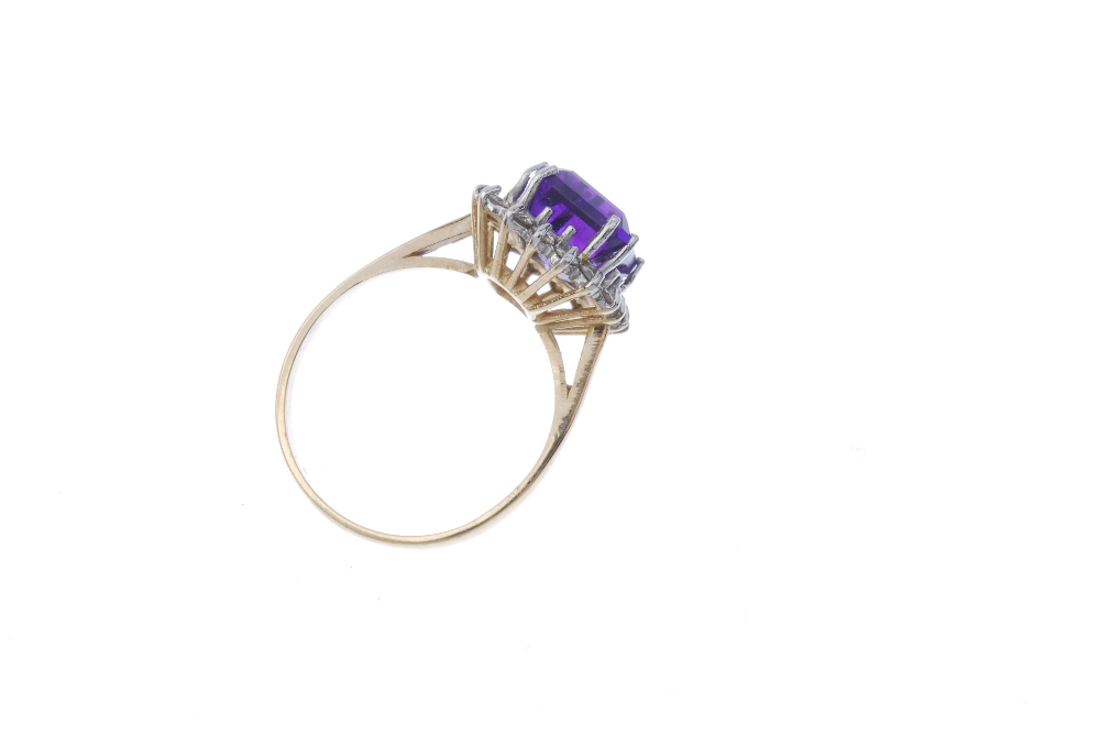 A 9ct gold amethyst and diamond cluster ring. The square-shape amethyst within a brilliant-cut - Image 4 of 4