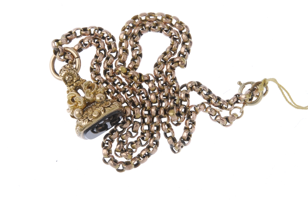 A late Victorian gold hardstone fob and later chain. The cushion-shape hardstone, to the scroll - Image 2 of 2