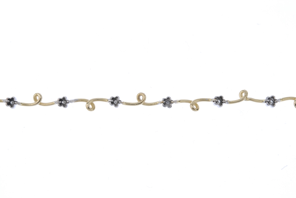 A bi-colour diamond bracelet. The brilliant-cut diamond flowers, with looped bar spacers, to the - Image 2 of 3