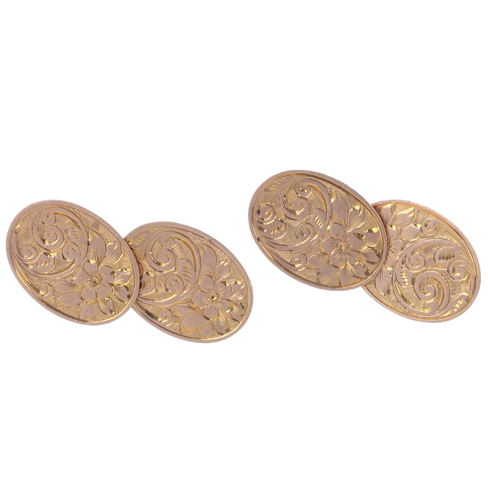 Two pairs of early 20th century 9ct gold cufflinks. To include a pair of oval-shape scroll