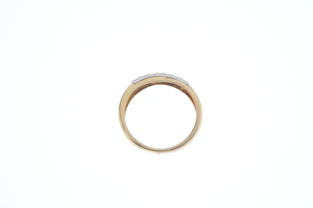 An 18ct gold diamond crossover band ring. The brilliant-cut diamond line crossover centre, to the - Image 3 of 3