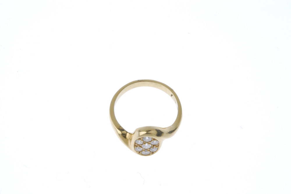 A diamond dress ring. The pave-set diamond oval-shape panel, to the asymmetric shoulders and plain - Image 2 of 4