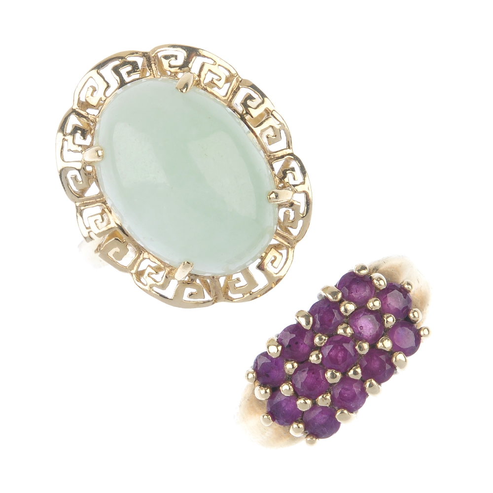 A selection of four gem-set dress rings. To include an amethyst and blue topaz five-stone ring, a