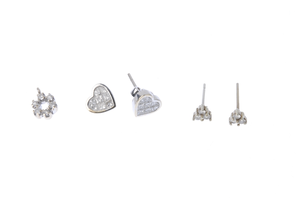 Two pairs of 18ct gold diamond ear studs and a diamond pendant. To include a pair of 18ct gold - Image 2 of 2