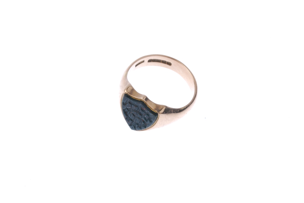 A 1920s 9ct gold bloodstone signet ring. The shield-shape bloodstone, with carved monogram, to the - Image 2 of 4
