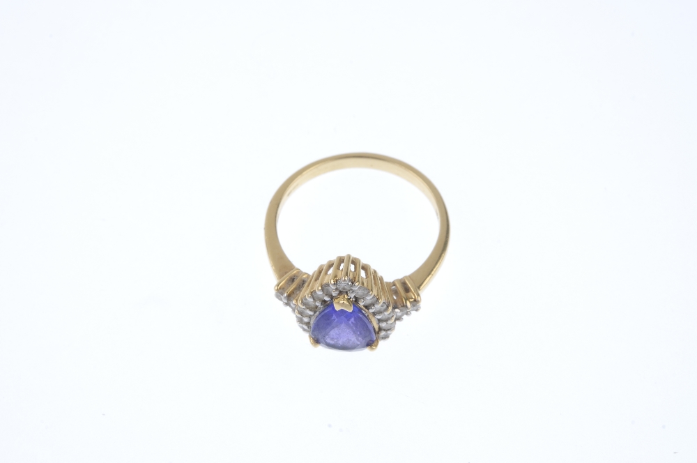 A coated tanzanite and diamond cluster ring. The pear-shape coated tanzanite, within a brilliant-cut - Image 2 of 4