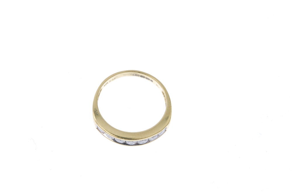 An 18ct gold diamond half-circle eternity ring. The brilliant-cut diamond line, to the tapered - Image 2 of 4