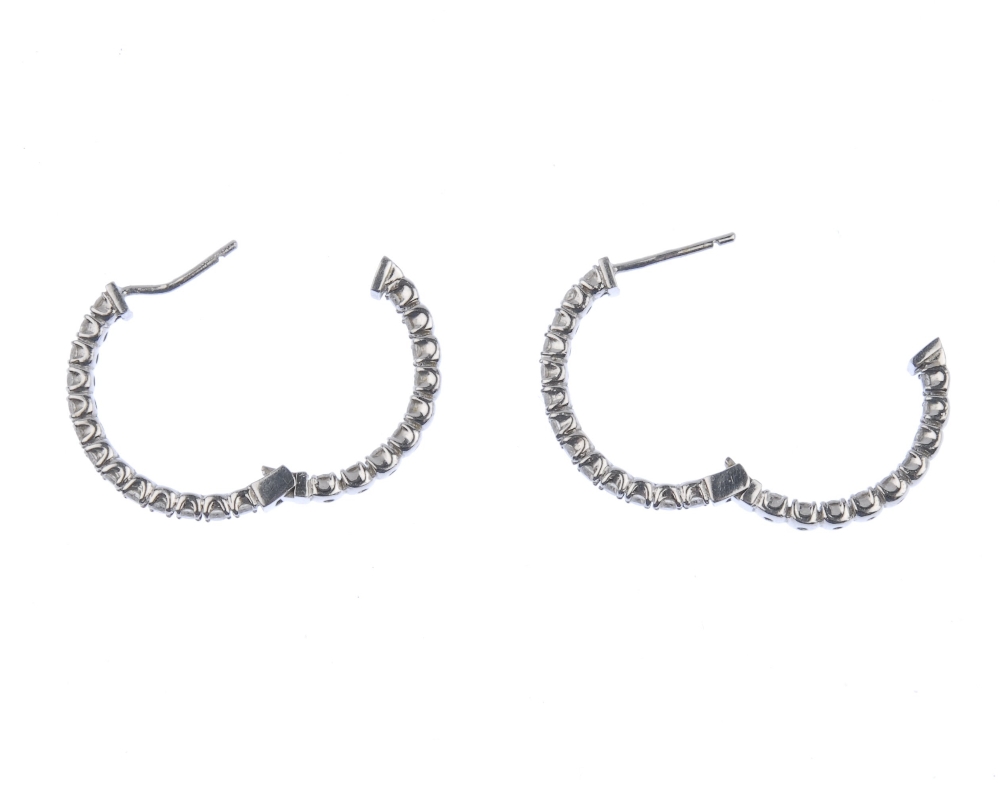 (539290-3-A) A pair of 14ct gold diamond hinged ear hoops. Each designed as a brilliant-cut - Image 2 of 3