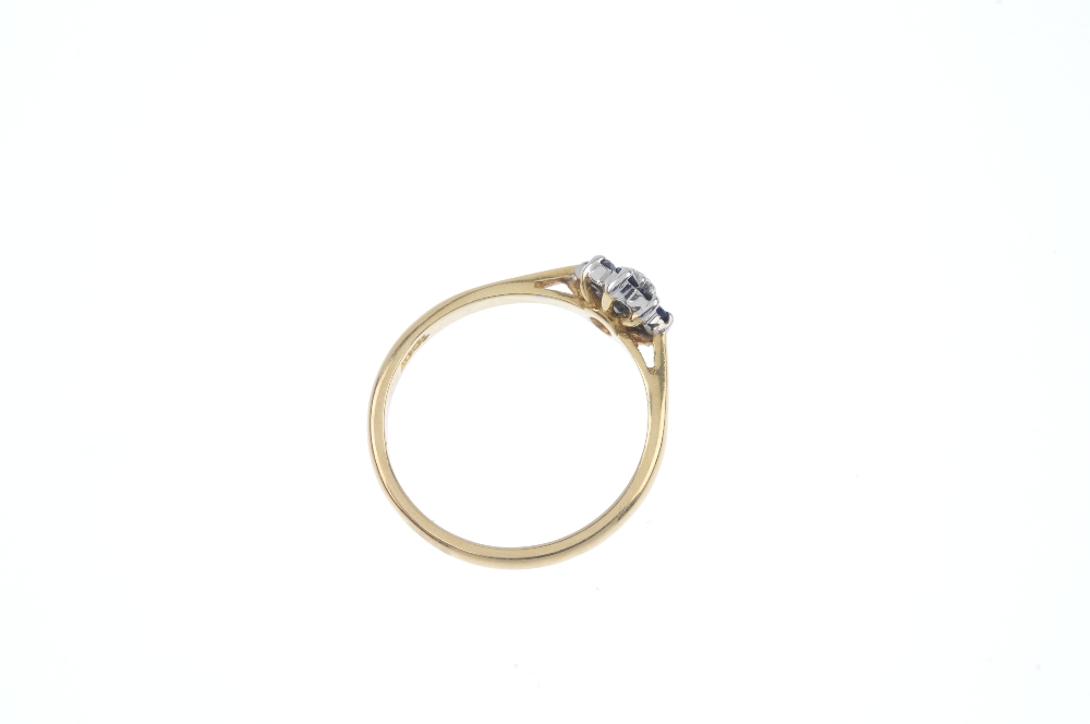 A diamond and sapphire cluster ring. The brilliant-cut diamond, within an circular-shape sapphire - Image 4 of 4