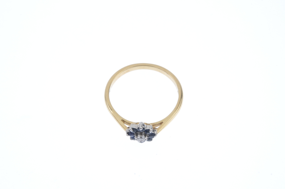 A diamond and sapphire cluster ring. The brilliant-cut diamond, within an circular-shape sapphire - Image 2 of 4