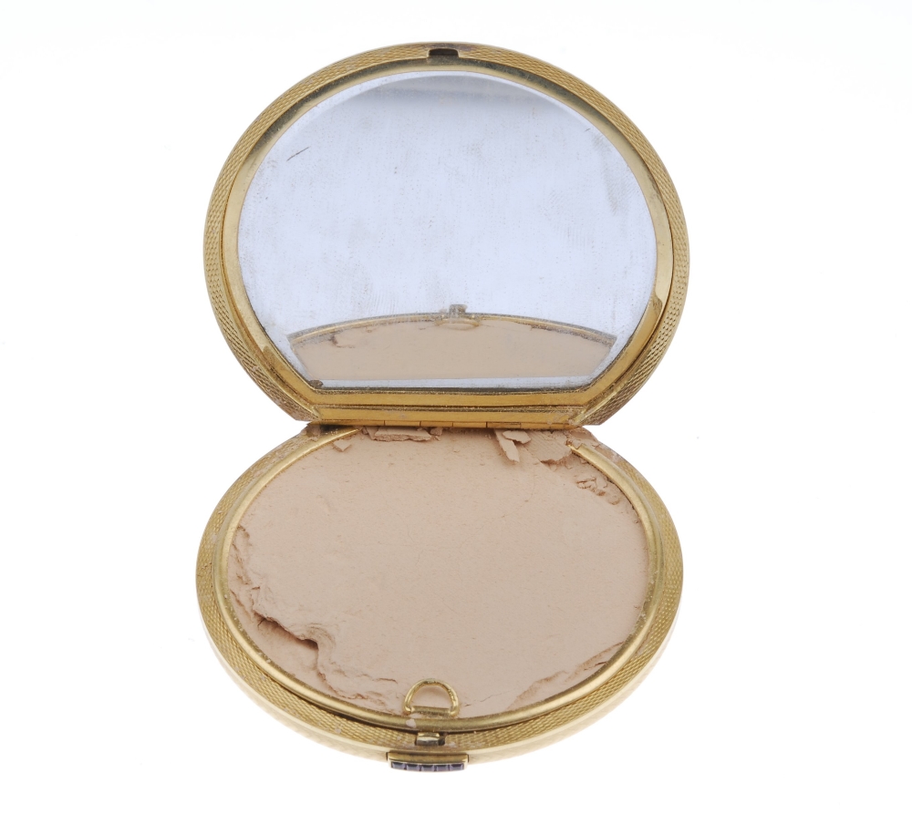 (543021-1-A) A 1950s 18ct gold powder compact. The circular-shape, engine-turned case, with - Image 3 of 3